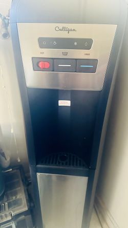 Bottom water cooler with bottles and stand