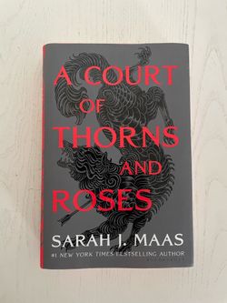 A court of thorns & roses hard cover book