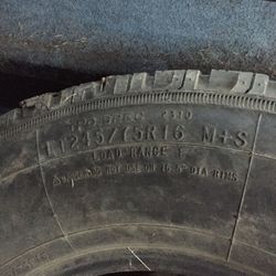 245 75 16 Uniroyal Laredo tire Mounted On 8 Lug Wheel