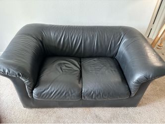 Black sofa and tv stand