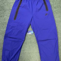 Nike tech woven blue pants
