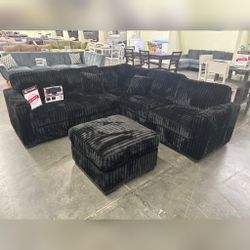 Black jumbo corduroy sectional sofa with ottoman 