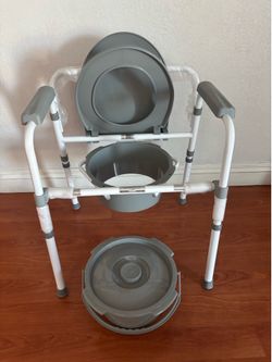 NEW Medline 3-in-1 folding bedside commode with a gray seat and a removable bucket.