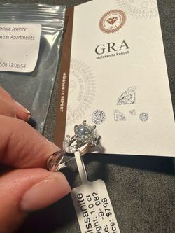 Moissanite Three-Stone Ring with GRA Certificate passes the diamond tester