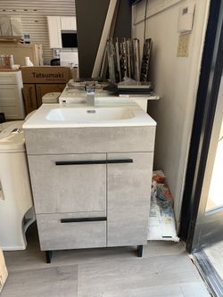 24ā vanity with counter and faucet $399