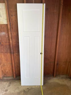 Solid wood white door.