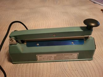 Plastic film heat sealer