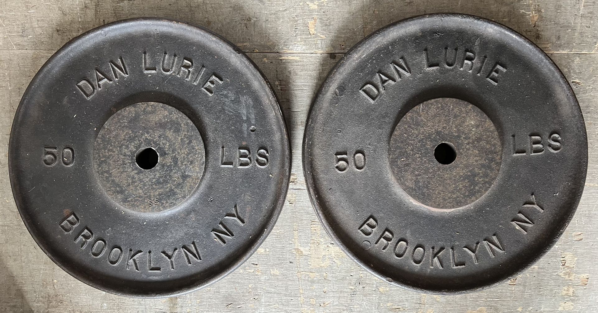 2 Vintage Dan Lurie 50 pound weights, Brooklyn NY