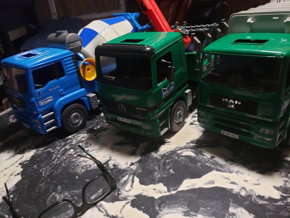 BRUDER TOY TRUCKS log truck and cement truck
