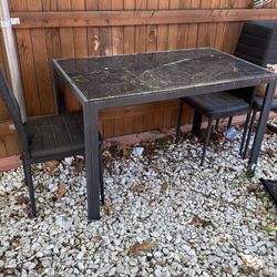 Glass dining table with 3 chairs