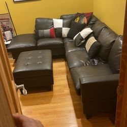 Faux Leather Sectional With Storage Ottoman 