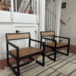 Cane black accent chairs with CB2 Sherpa pillows