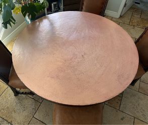 Copper dinning table with 4 leather chairs