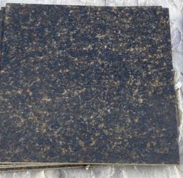 Ubatuba granite tiles calibrated, polished, and bevelled dark green/looks black 16”x16”
