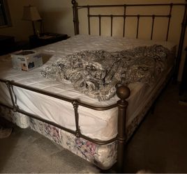 Clean solid California king bedframe. Including all hardware, double twin boxspring and a king-size mattress.