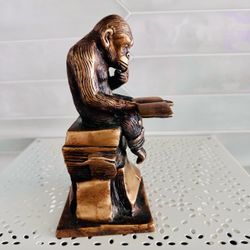 vintage Charles Darwin's Reading Monkey solid brass sculpture/ bookend. He is heavy weighted 3 pounds. 7“Tall x 3 1/2“ across the bottom base