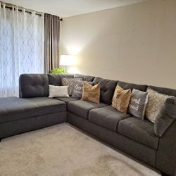 couches  Ashley gray sectional, in excellent condition.