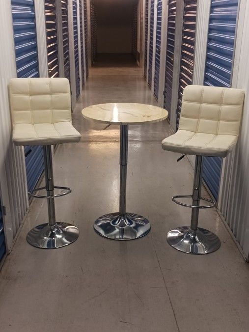 2 cream and chrome stools & table to match