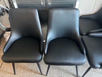 Black faux leather dining chairs