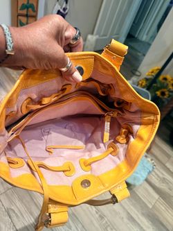 Dooney & Bourke patent leather.