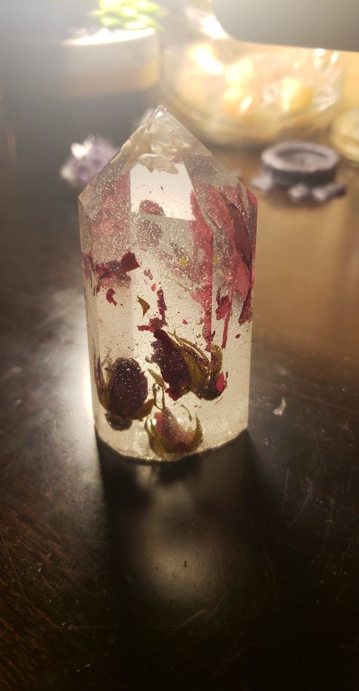resin crystal with rose buds and petals, and snake vertebrae