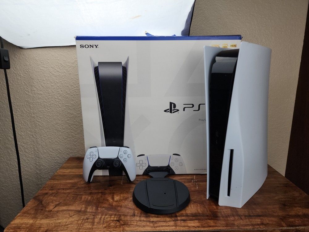 Playstation 5 With Controller, Box, And Stand.