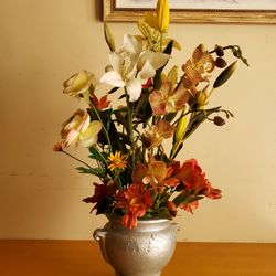 Artificial home made flower arrangement 