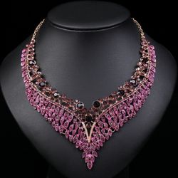 Necklace and earrings set with an exaggerated retro style and exquisite design. Formal evening gown with colorful droplets.
