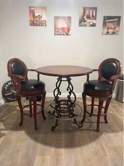 Bar height table and two chairs
