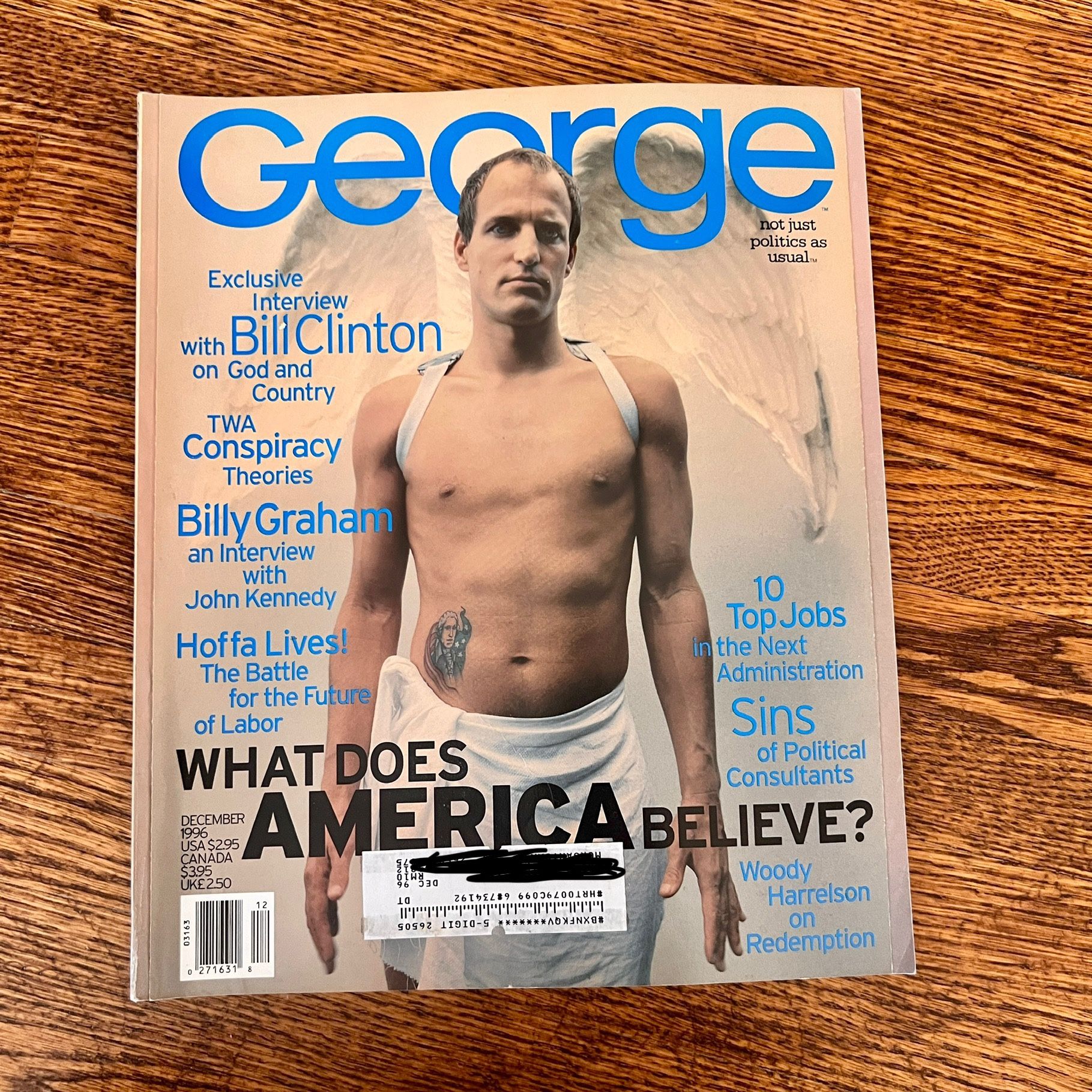 George Magazine - December 1996 - What does American Believe? - Woody Harrelson. One crease across back cover 