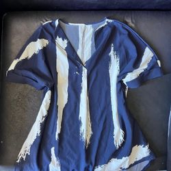 Loose fitting v neck women’s blouse with blue and white abstract pattern