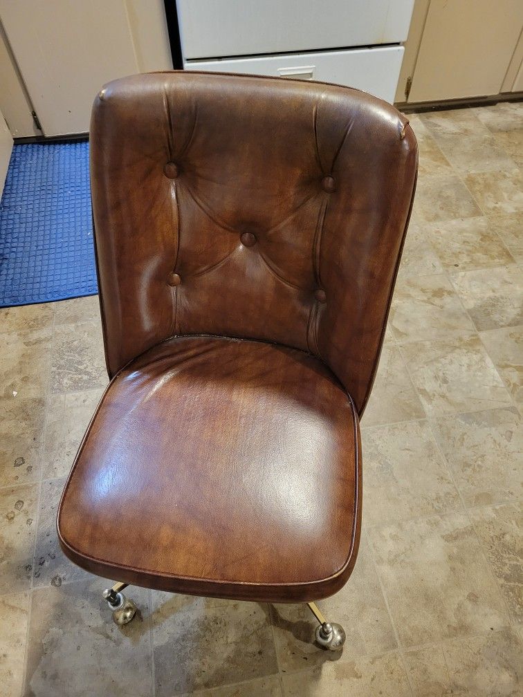 Table And Two Padded Rolling Chairs
