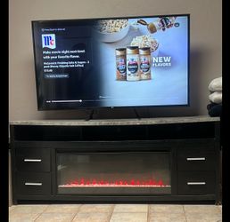 Tv stand with fireplace.