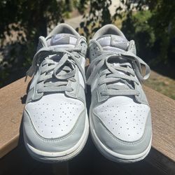 Nike Dunk Low sneakers in a light gray and white colorway