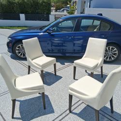 4 Beige Leatherette Chairs
