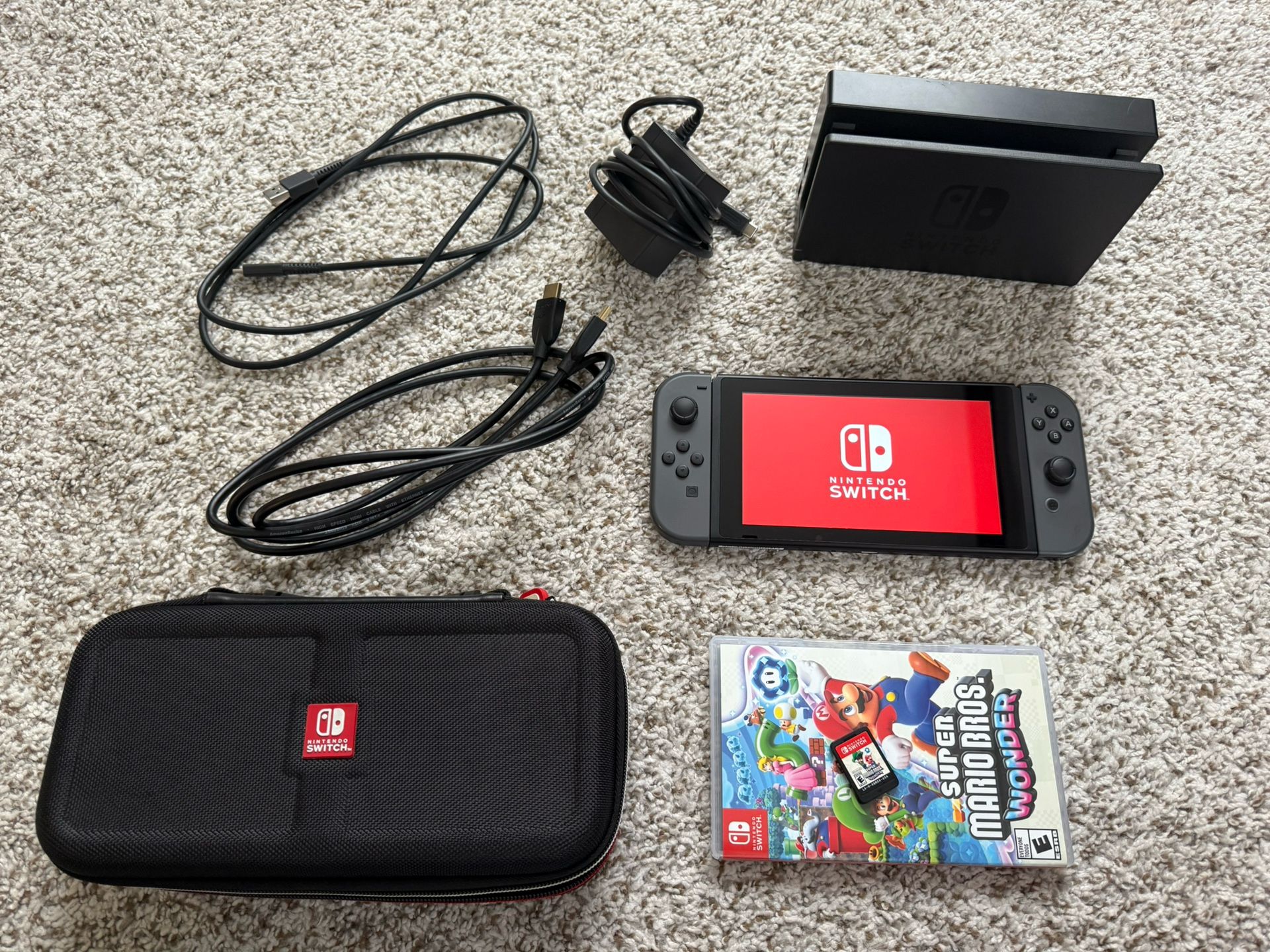 Nintendo Switch Console with Carrying Case and Mario Wonder