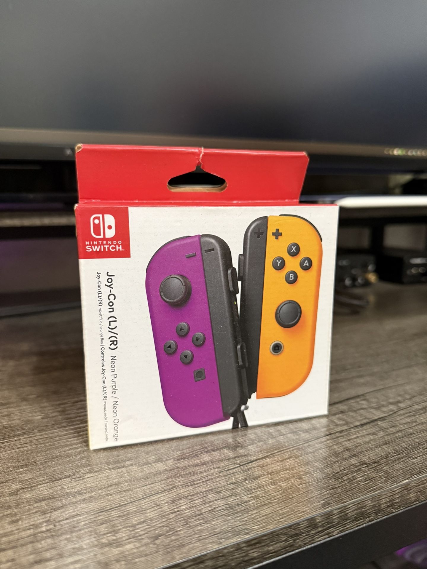 Nintendo Switch Joycons Purple and Orange