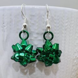 These are gorgeous green christmas bow earrings with plated Sterling Silver earring hooks . They will Make a beautiful festive addition to any