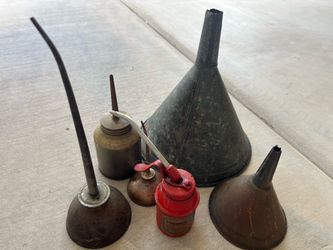 Antique oil, cans, and funnels