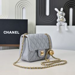 A small cream blue perfume bag