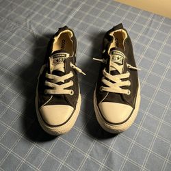 Black Converse All Star sneakers.