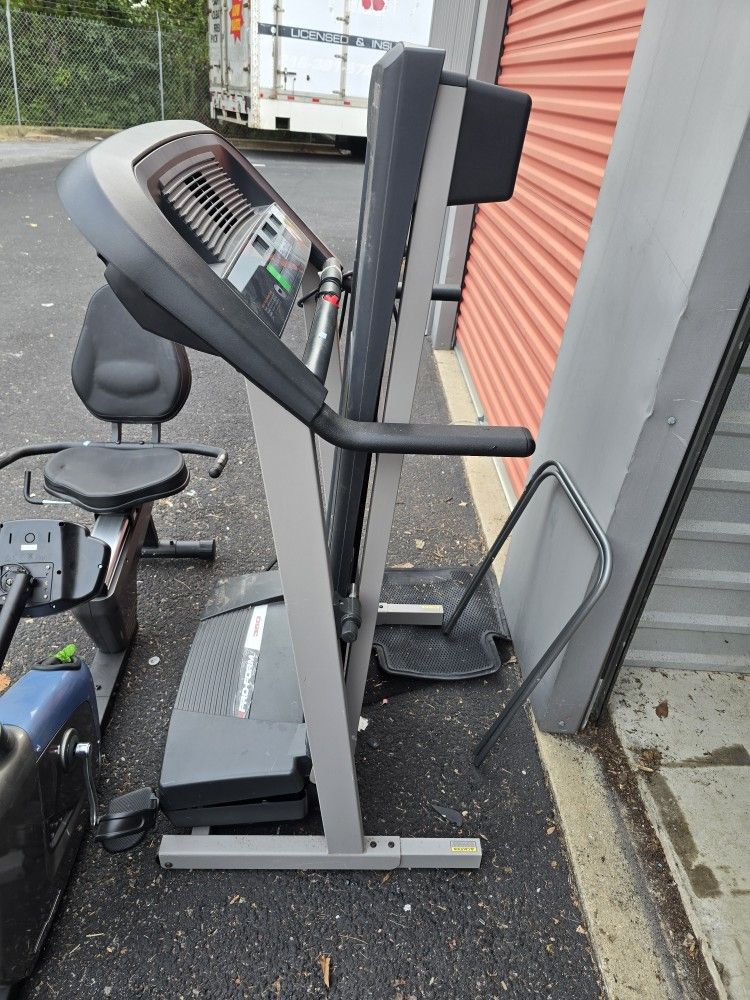 Two Exercise Treadmills and One Exercise Bike