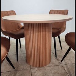 Round table featuring a modern and minimalist design.