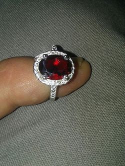 Red. Garnet with white sapphair around stone