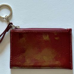 Used - 100% authentic Coach patent maroon keychain wallet