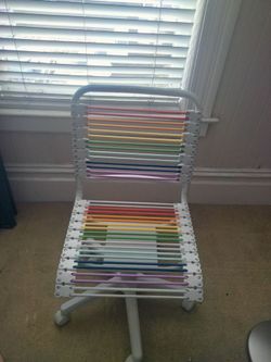 Cool white Bungie cord swivel chair