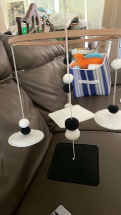 Black and white mobile for babies changing table
