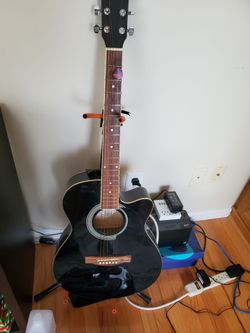 Acoustic guitar and stand.
