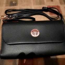 Leather wallet clutch, with adjustable straps 5"x8" like new!