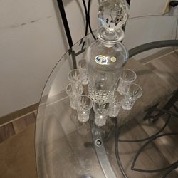 Crystal gorgeous decanter with 8 glasses; NOTE: If it's posted; it's available.  